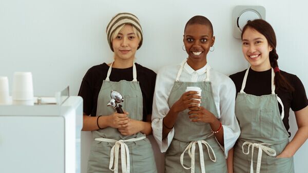 Happy ice cream shop employees smile for photo thanks to HSA for America's health insurance for small business owners